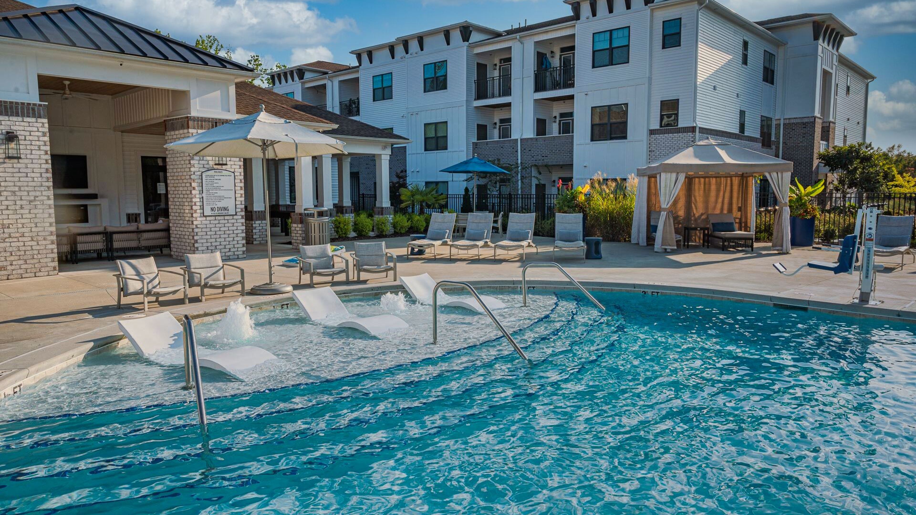 Hawthorne at Smith Creek luxury outdoor pool with in-pool lounge chairs and surrounding seating